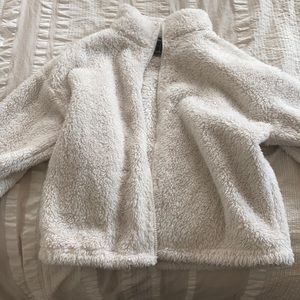 Small, white, fluffy zip up jacket